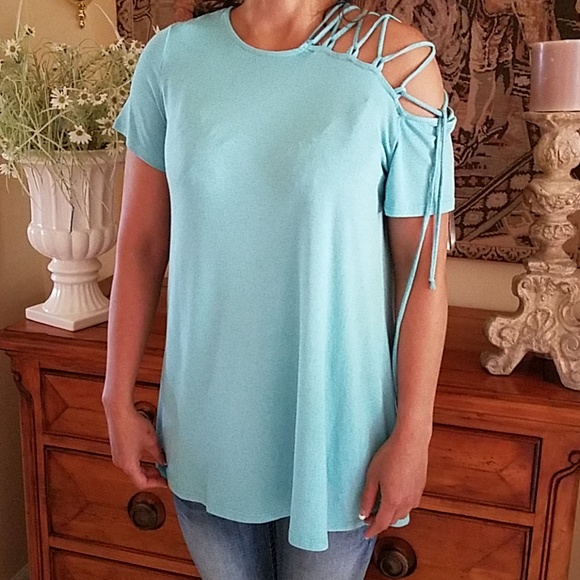 1.4.3. Story by Line Up Tops - NWOT Turquoise tunic w/lace detail on shoulder